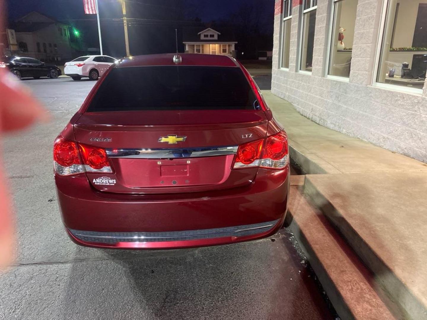 2015 RED CHEVROLET CRUZE LTZ (1G1PG5SB5F7) with an 1.4L engine, Automatic transmission, located at 3100 Covert Avenue, Evansville, IN, 47714, (812) 473-4492, 37.955418, -87.512238 - Photo#2