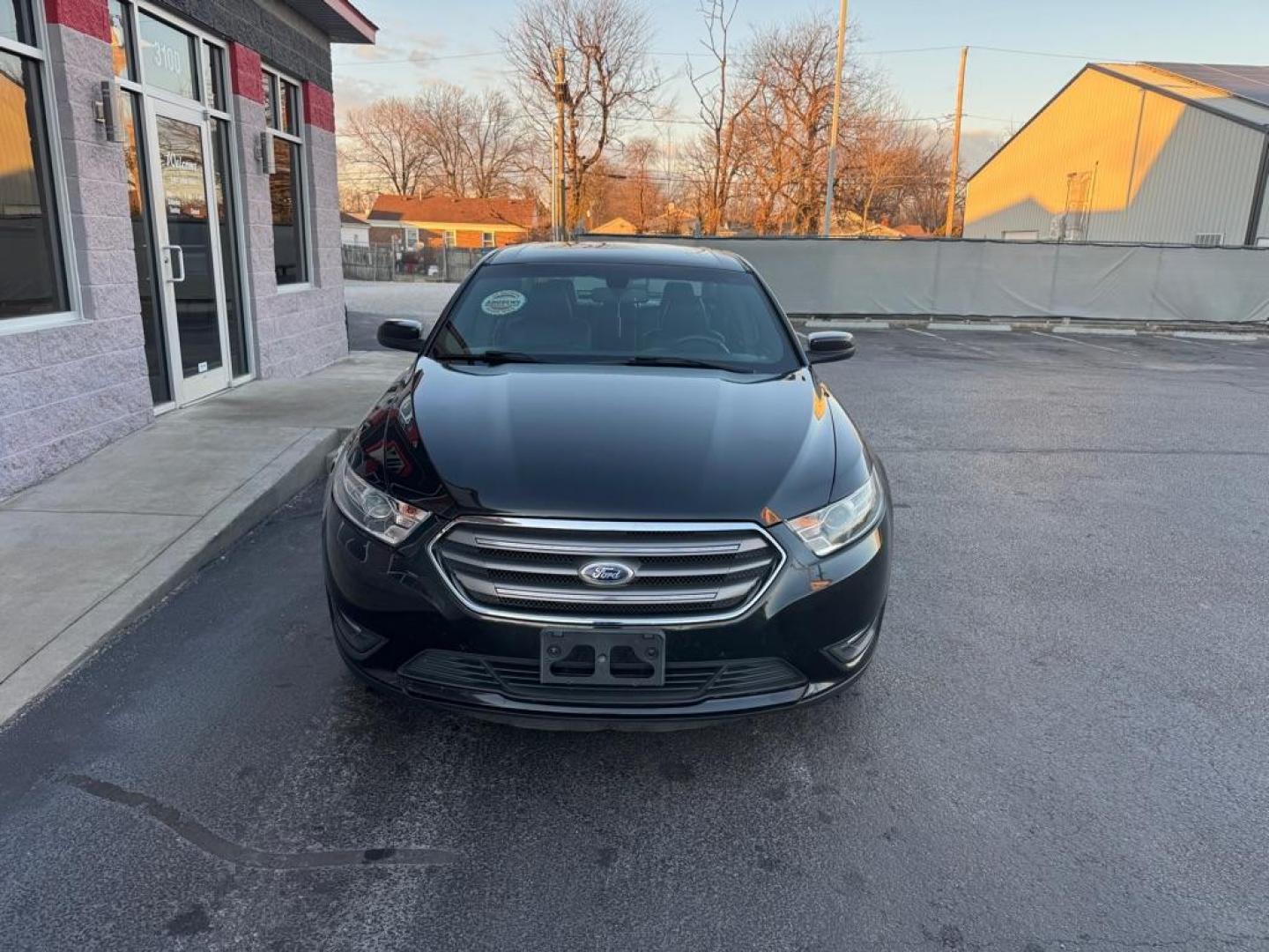 2015 BLACK FORD TAURUS SEL (1FAHP2H87FG) with an 3.5L engine, Automatic transmission, located at 3100 Covert Avenue, Evansville, IN, 47714, (812) 473-4492, 37.955418, -87.512238 - Photo#1