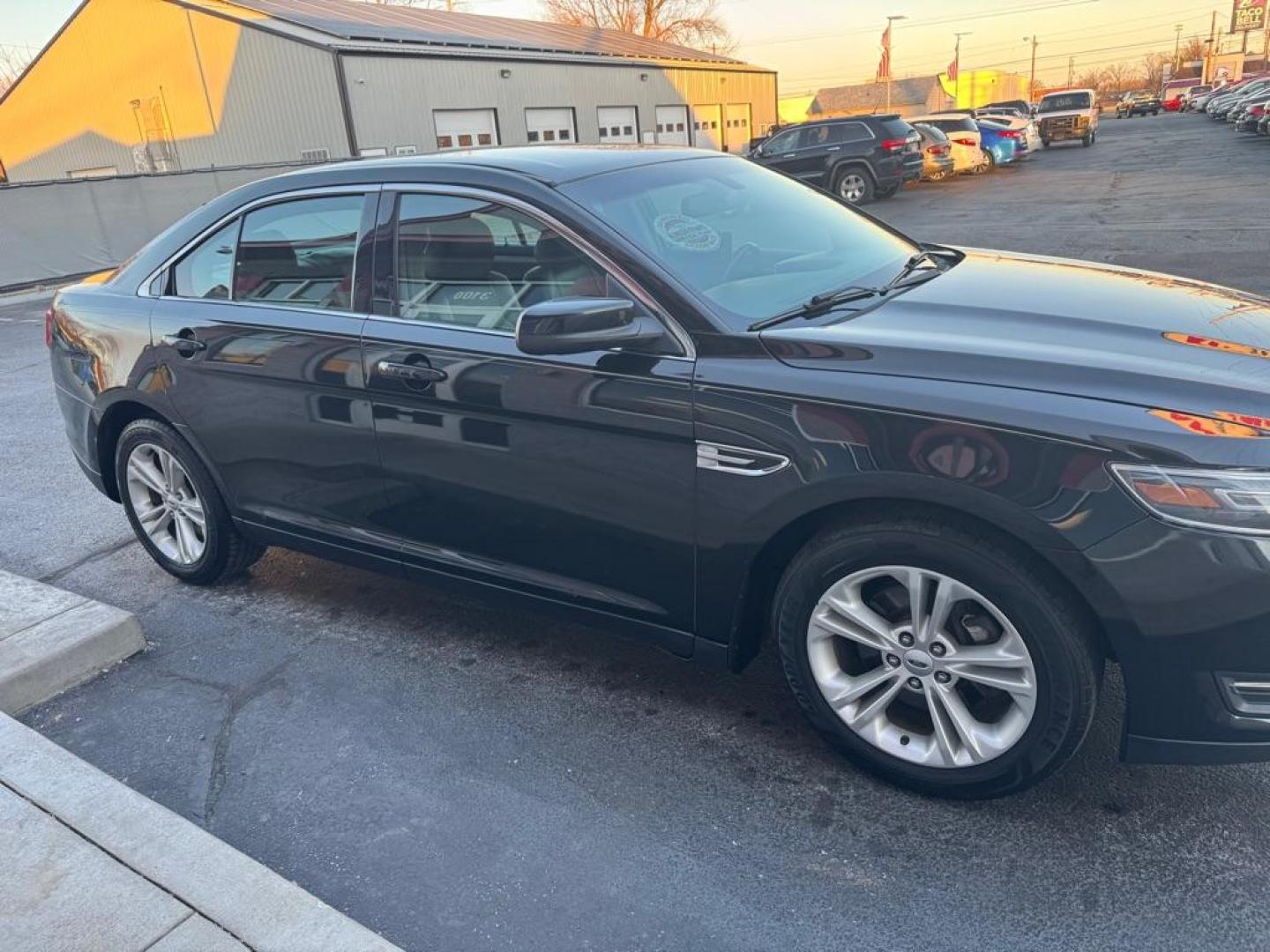 2015 BLACK FORD TAURUS SEL (1FAHP2H87FG) with an 3.5L engine, Automatic transmission, located at 3100 Covert Avenue, Evansville, IN, 47714, (812) 473-4492, 37.955418, -87.512238 - Photo#2