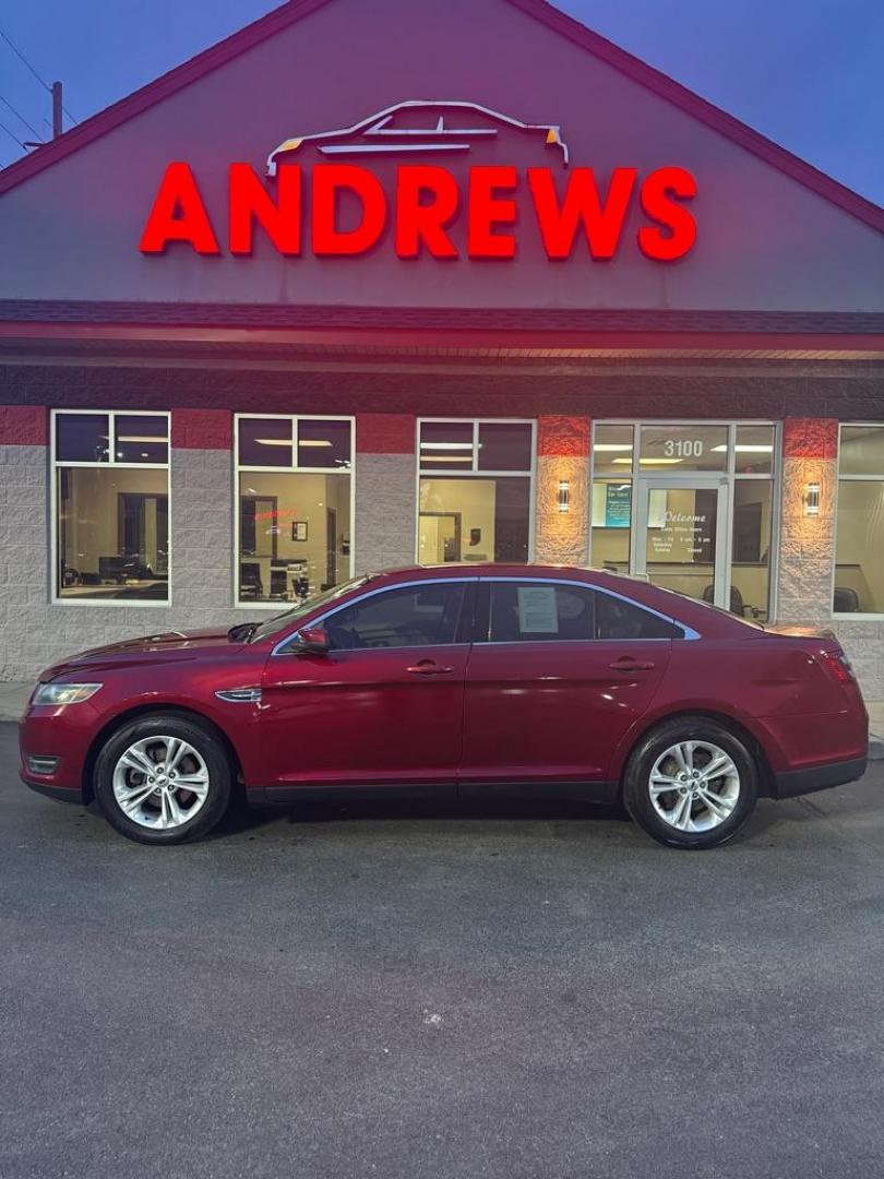 2014 RED FORD TAURUS SEL (1FAHP2E85EG) with an 3.5L engine, Automatic transmission, located at 3100 Covert Avenue, Evansville, IN, 47714, (812) 473-4492, 37.955418, -87.512238 - Photo#0