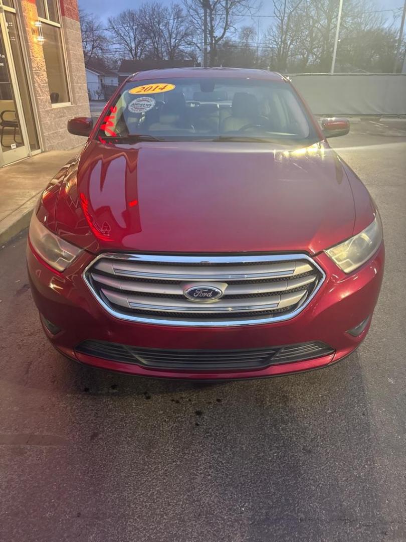 2014 RED FORD TAURUS SEL (1FAHP2E85EG) with an 3.5L engine, Automatic transmission, located at 3100 Covert Avenue, Evansville, IN, 47714, (812) 473-4492, 37.955418, -87.512238 - Photo#1