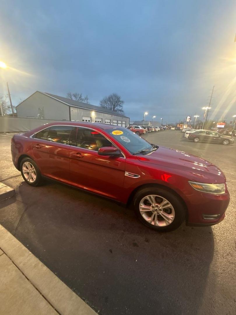2014 RED FORD TAURUS SEL (1FAHP2E85EG) with an 3.5L engine, Automatic transmission, located at 3100 Covert Avenue, Evansville, IN, 47714, (812) 473-4492, 37.955418, -87.512238 - Photo#2
