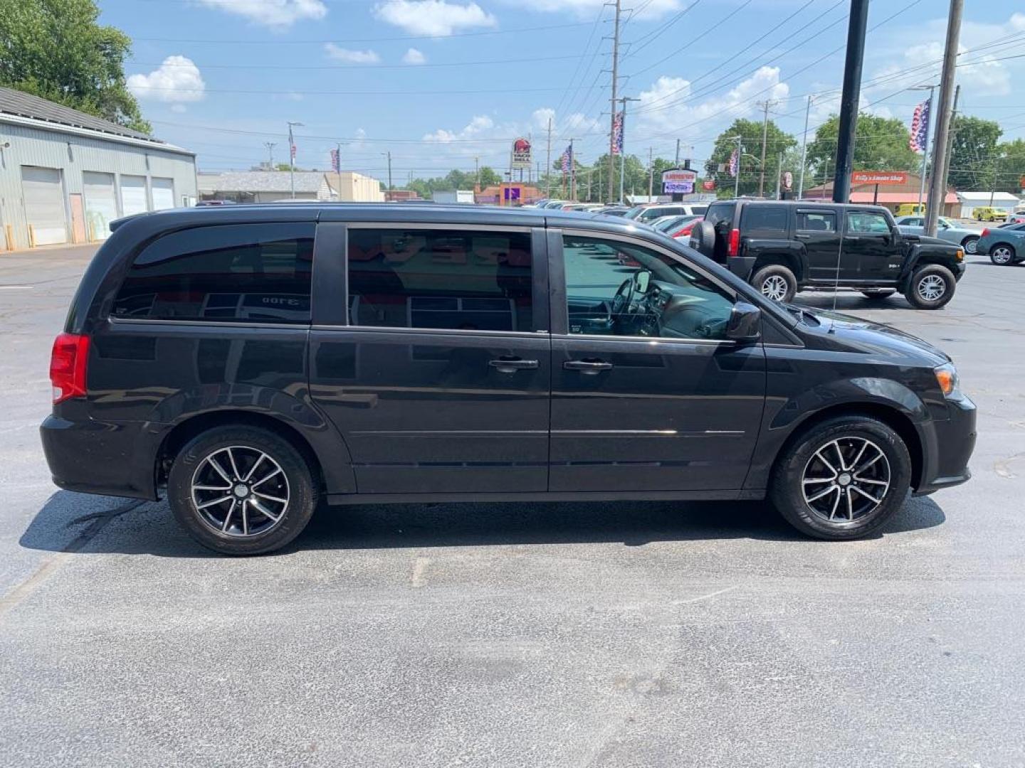 2014 BLACK DODGE GRAND CARAVAN SXT (2C4RDGCG7ER) with an 3.6L engine, Automatic transmission, located at 3100 Covert Avenue, Evansville, IN, 47714, (812) 473-4492, 37.955418, -87.512238 - Photo#2